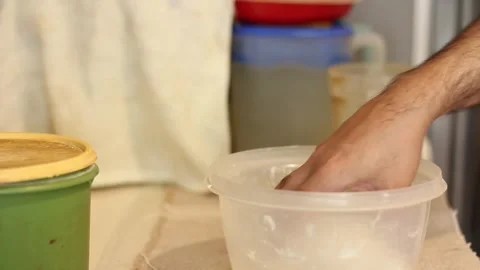 Process to give the round shape to the corn cakes or arepas with both hands. Stock Footage 306029750