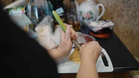 The process of grating cheese on a grater Stock Footage 154118113