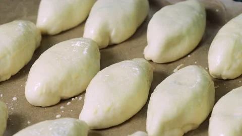The process of greasing the patties with egg before baking. Stock Footage 229688474