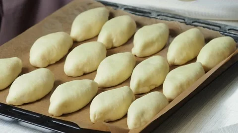 The process of greasing the patties with egg before baking. Stock Footage 229688475