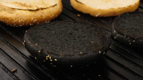 Process of grilling buns for burgers, Chef flips over buns by iron spatula Stock Footage 76952285