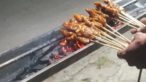 The process of grilling chicken satay Stock Footage 323364686