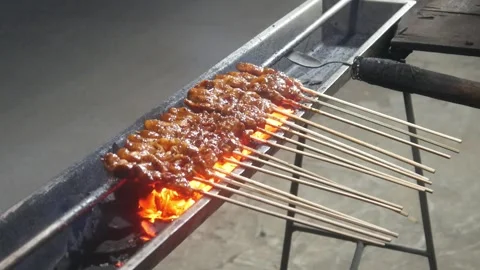 The process of grilling chicken satay Stock Footage 323364800