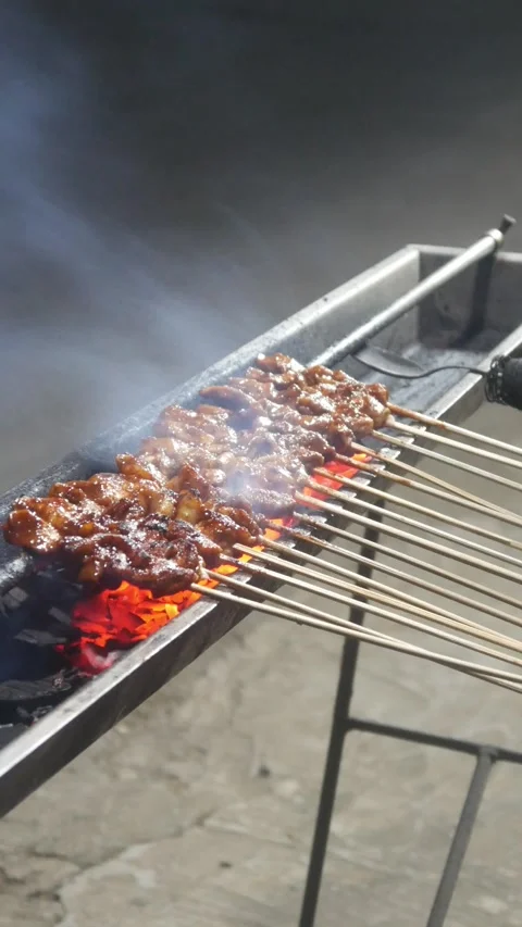 The process of grilling chicken satay Stock Footage 323364808