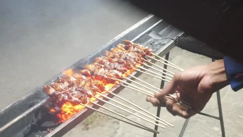 The process of grilling chicken satay Stock Footage 323364809