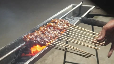The process of grilling chicken satay Stock Footage 323364830