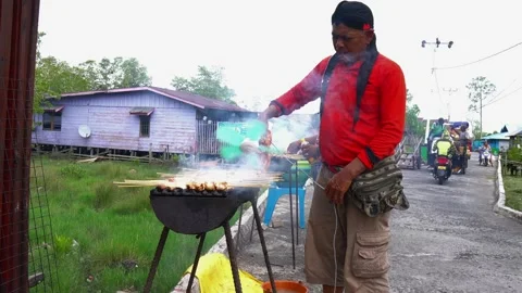 The process of grilling fresh chicken satay with natural fire Stock Footage 243437132
