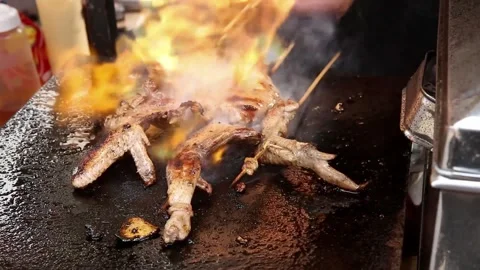 The process of grilling grilled chicken using hand gas Stock Footage 270347625