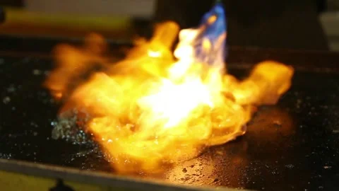 The process of grilling squid, while grilling using handheld gas Stock Footage 265675041