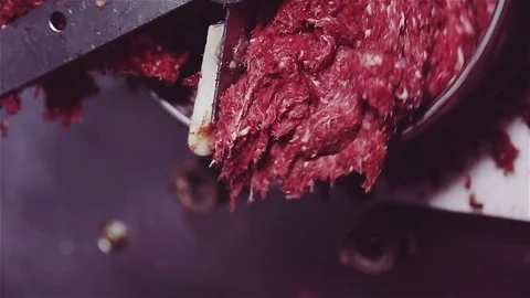 Process of grinding and processing meat in minced meat. Stock Footage 78587999