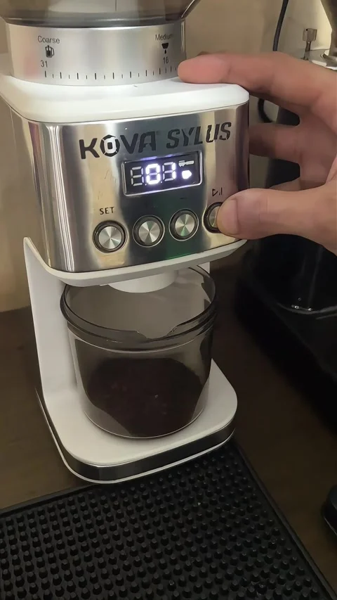 The process of grinding coffee beans with kova sylus coffee grinder Stock Footage 274115151