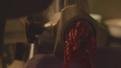 The process of grinding meat in an electric meat grinder. Stock Footage 231334923