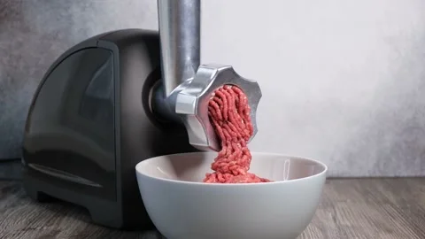 Process of grinding meat in the kitchen at home Stock Footage 143992271