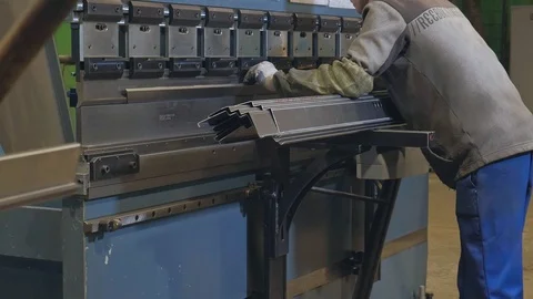 The process of grinding metal blanks, the production of metal doors Stock Footage 100542186