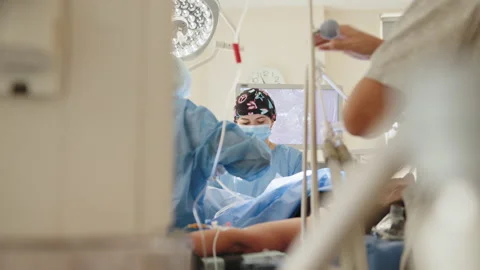 Process of Gynecological surgery operation. Female doctors performing Stock Footage 172394699