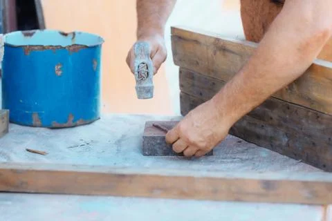 Process hammering a nail, building or repair Stock Photos