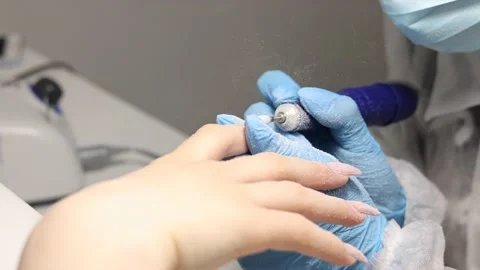 The process of hardware manicure in the salon, removing gel polish or acrylic Stock Footage 148416216