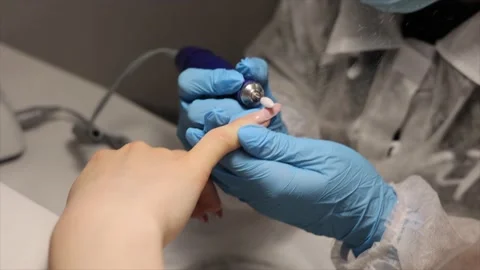 The process of hardware manicure in the salon, removing gel polish or acrylic Stock Footage 148423026
