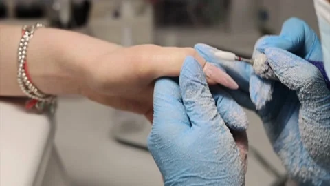 The process of hardware manicure in the salon, removing gel polish or acrylic Stock Footage 148488914