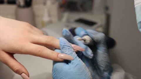 The process of hardware manicure in the salon, removing gel polish or acrylic Stock Footage 148492157