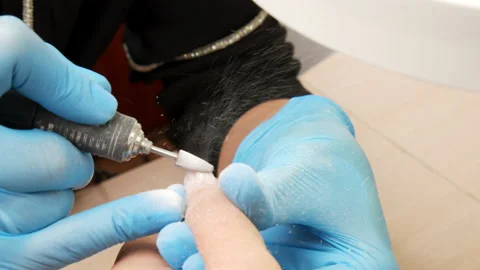Process of hardware manicure in the salon, removing gel polish or acrylic fro Stock Footage 162513478