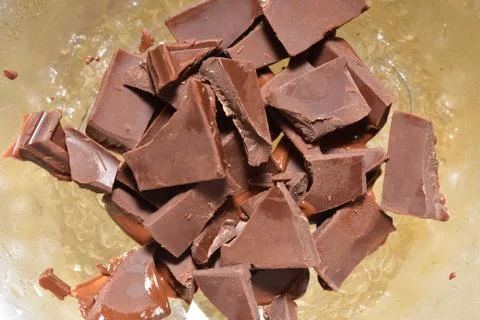 The process of heating the chocolate so that it becomes melted. Melted chocol Stock Photos