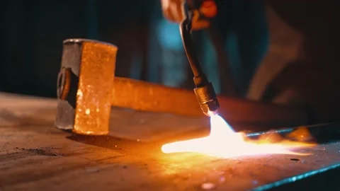 The process of heating a metal part with a gas burner Stock Footage 226331307