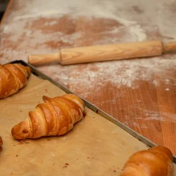 The process of homemade croissants. The process of making a croissant in a ba Stock Photos