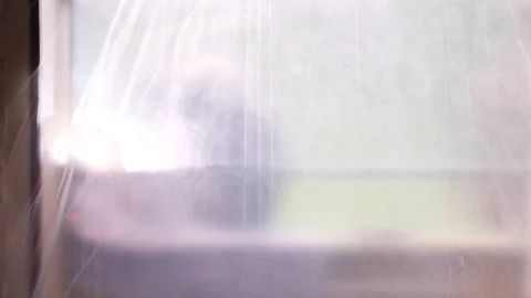 Process of house windows installation, workers behind the transparent oilcloth Stock Footage 224901256