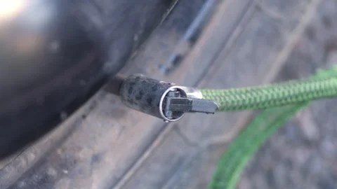 Process of inflating tire and strengthening wheel density through pump hose Stock-Footage 324200958
