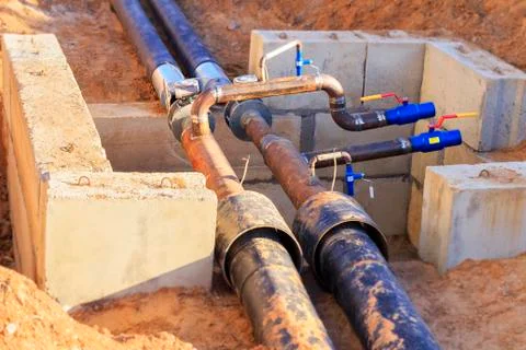 The process of installation of the distribution unit heating network. Stock Photos