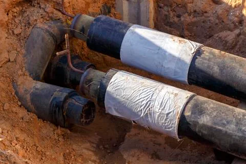 The process of installation of the distribution unit heating network. Stock Photos