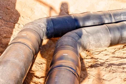 The process of installation of the distribution unit heating network. Stock Photos