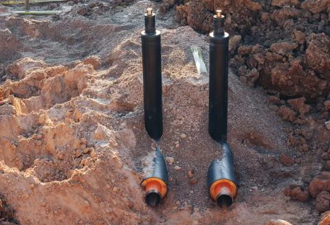 The process of installation of the distribution unit heating network. Stock Photos