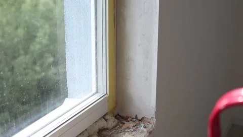 Process installation slopes of window. Using a moanting foam. Stock Footage 137841859