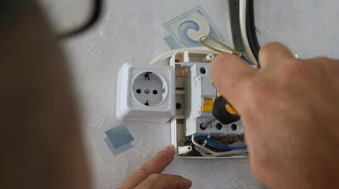 The process of installing a circuit breaker and socket Stock Photos