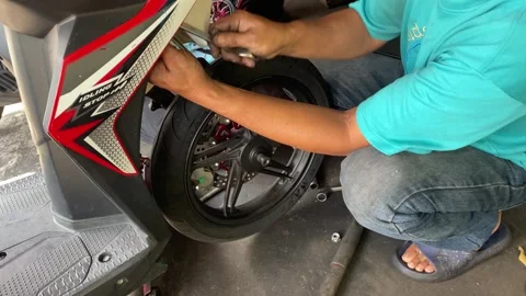 The process of installing, dismantling and repairing the front shock absorbers Stock Footage 336428512
