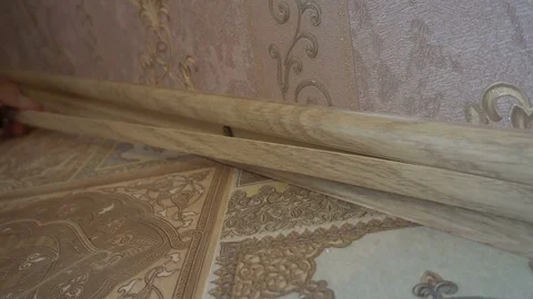 The process of installing the floor, a worker installs the insert into the Stock Footage 79600747