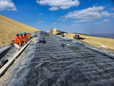 Process of installing geosynthetics and clay cover in mine fills Stock Photos