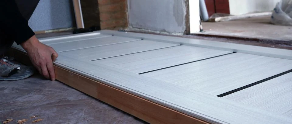 The process of installing an interior door frame Stock Photos