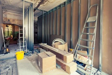 Process of installing metal frames for plasterboard - drywall and construction Stock Photos