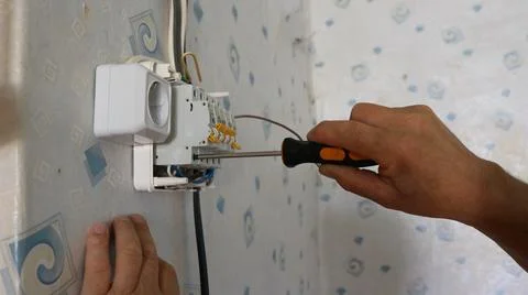 The process of installing a modular circuit breaker in an electrical panel Stock Photos