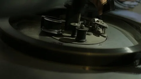 The process of installing old film into the reel to watch a movie at the cinema Stock Footage 93713367