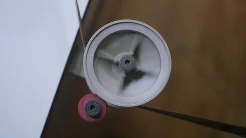 The process of installing old film into the reel to watch a movie at the cinema Stock Footage 93713486