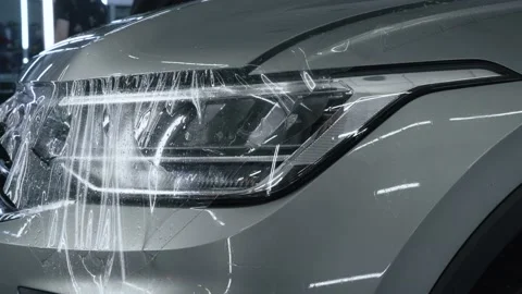 Process of installing of Paint Protection Film or PPF on new car in professional Stock Footage 150402328