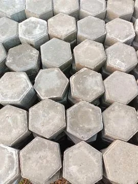 The process of installing pentagon-shaped paving blocks. Stock Photos
