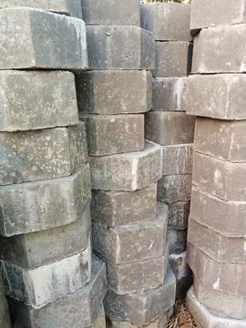 The process of installing pentagon-shaped paving blocks. Stock Photos