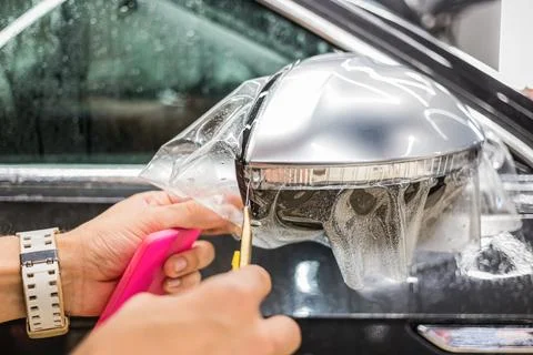 Process of installing PPF on car. Stock Photos