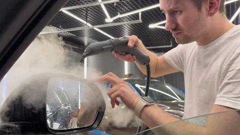 The process of installing PPF on the side mirror. Stock Footage 322772604