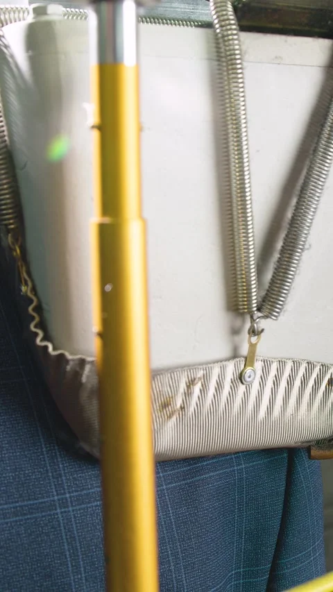 Process ironing shoulder of man's jacket in sewing factory using special press Stock Footage 326477718